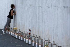 A visitor kisses the memorial wall at Shanksville, PA - site where the first 9/11 Citizen Heroes - the crew and passengers of United Flight 93 -took on their attackers